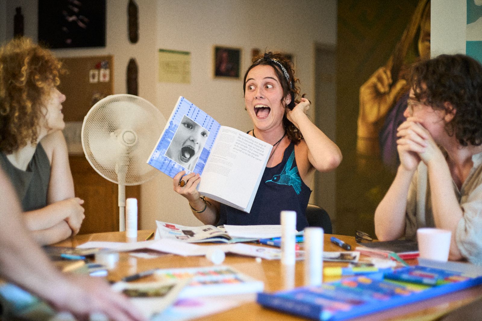 Artists laughing during a creative workshop
